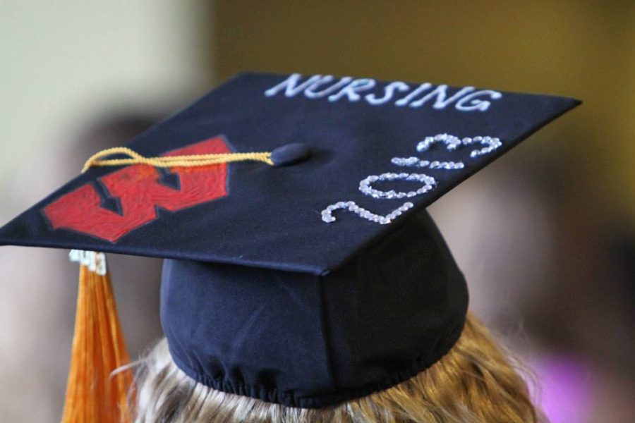 photo of a graduating nurse's mortarboard hat at graduation, decorated with