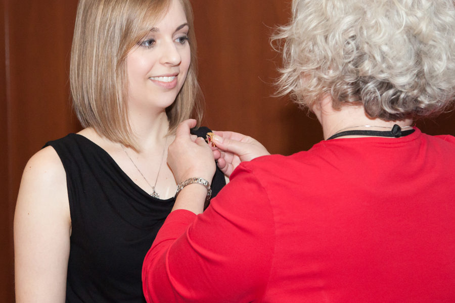photo of a senior nursing student receiving a pin award
