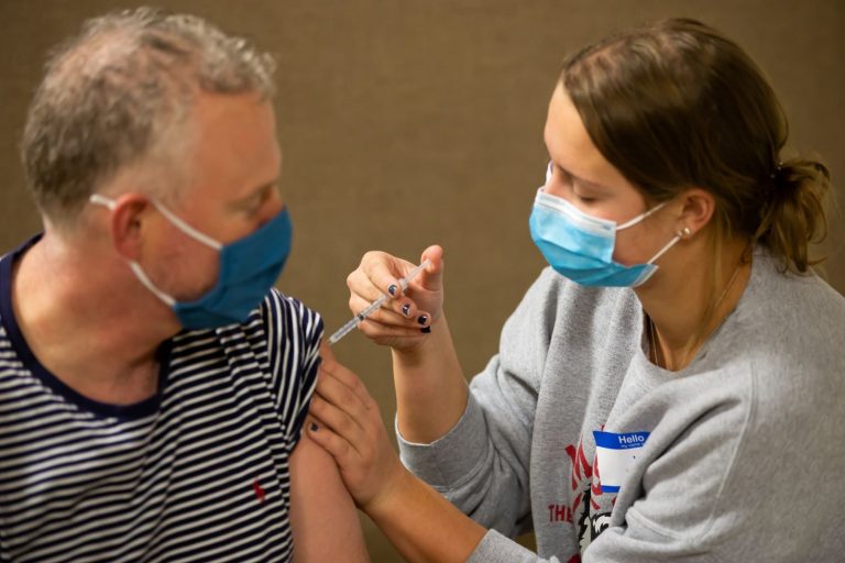 School of Nursing BSN student administers COVID vaccination