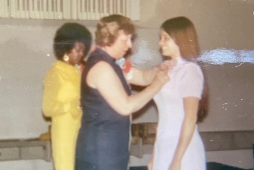 Pinning ceremony at School 1971. Dean pins graduating BSN student.
